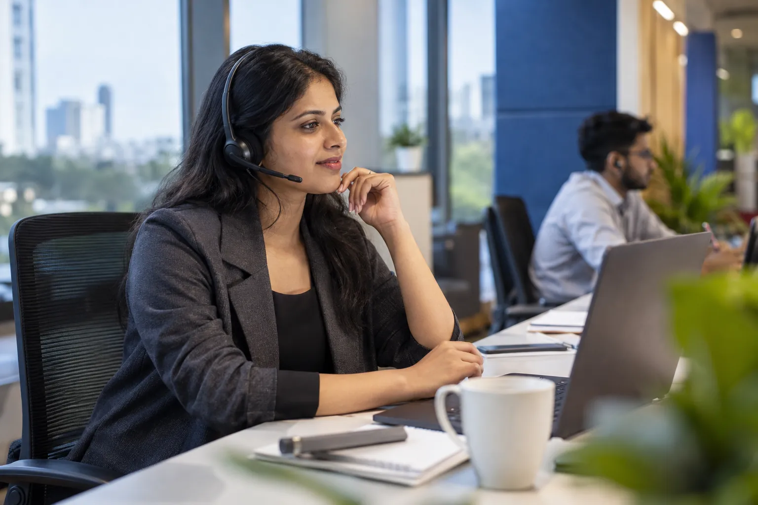Illustrative AI-generated scene of an Indian customer operations professional at work